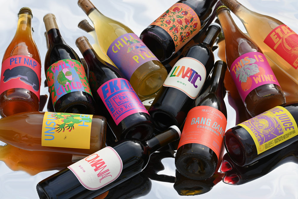 'The Full Monty' 12 Pack group of bottles on reflective background