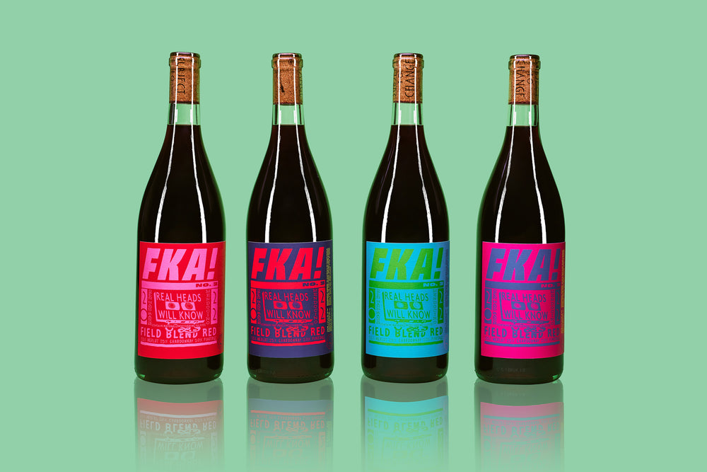 
                  
                    Load image into Gallery viewer, Four bottles of 2022 Open Hand Ranch &amp;#39;FKA!&amp;#39; Field Blend on green background
                  
                