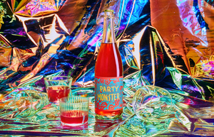 2022 Dorn Vineyard ‘Party Monster’ Pet Nat Sparkling Rosé on iridescent backdrop with glasses