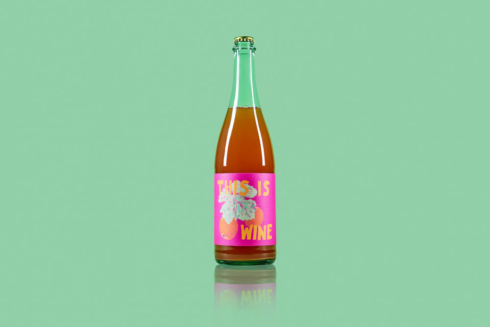 2021 'This Is Wine' Sparkling Apple Cider Pressed on Carignan Skins on green bacground