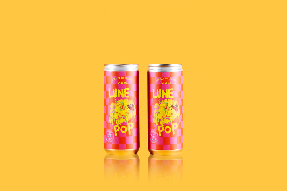 two 2021 'Lune Pop' Sparkling Red Cans on yellow backround