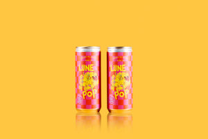 two 2021 'Lune Pop' Sparkling Red Cans on yellow backround